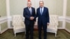 Russia's Foreign Minister Sergei Lavrov (right) shakes hands with Tajikistan's Foreign Minister Sirojiddin Muhriddin as they meet on the sidelines of a CIS conference in Minsk on April 12. 