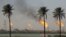 Flames emerge from burning excess gas from the oil fields in Basra. File photo