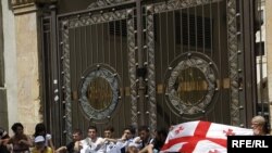 Opposition protesters block the entrance to parliament in Tbilisi on July 20.