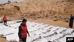 The bodies of 74 migrants who drowned in the Mediterranean trying to reach Europe after they washed up on a beach near Zawiyah on Libya’s northern coast, in February 2017.