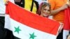 A female supporter of the Syrian national team attends the FIFA World Cup 2018 qualification football match between Syria and Iran at Azadi Stadium in Tehran on September 5.