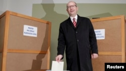 Czech Social Democratic Party leader Bohuslav Sobotka casts his vote at a polling station during an early general election on October 25.