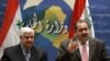 Syria's Foreign Minister Walid al-Muallim (left) and Iraq's Foreign Affairs Minister Hoshyar Zebari