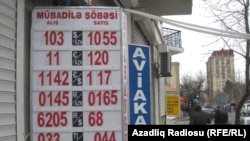 Azerbaijan -- information board displaying currency exchange rates, Baku, 2Feb2015