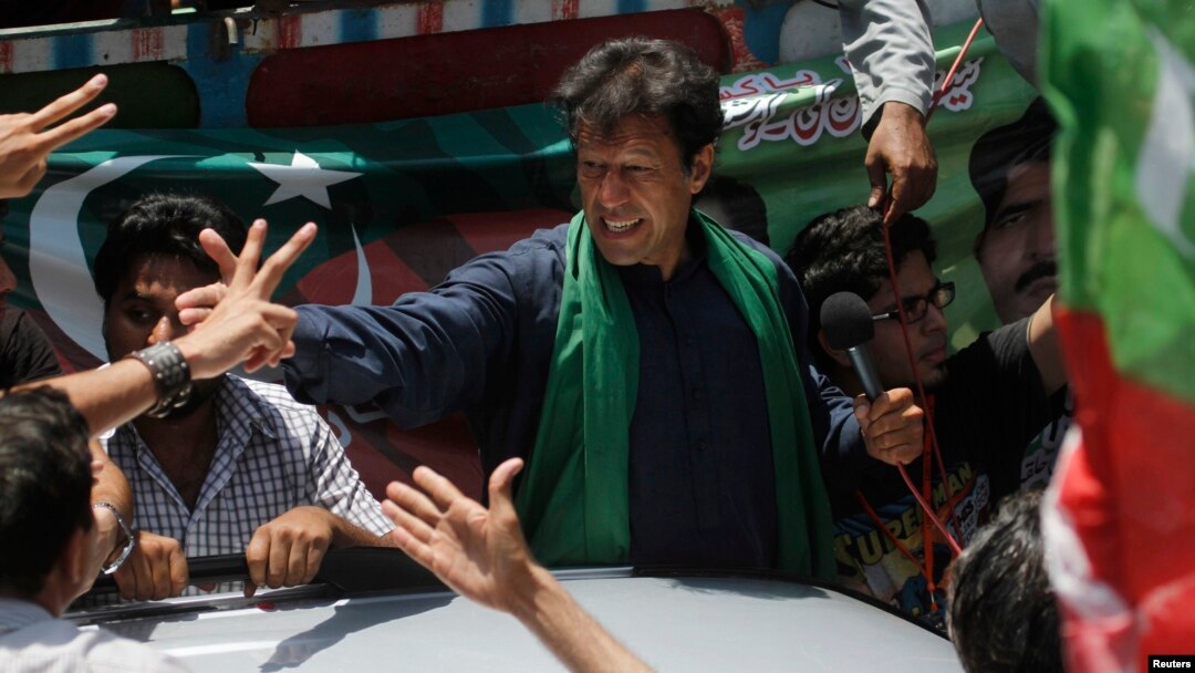 Imran Khan, chairman of the Pakistan Movement for Justice party (PTI) party, greets supporters after his visit to the mausoleum of Mohammad Ali Jinnah during an election campaign in Karachi earlier on May 7.