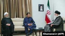 Iranian Supreme Leader Ayatollah Ali Khamenei meets with Pakistani Prime Minister Imran Khan (C) and Iranian President Hassan Rohani (L) in Tehran, October 13, 20169