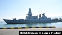 The British Royal Navy destroyer HMS Defender is moored in the Black Sea port of Batumi on June 26.