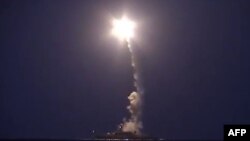 A Russian Defense Ministry video grab reportedly shows a Russian warship launching a cruise missile in the Caspian Sea during a strike against Islamic State (IS) group positions in Syria on October 6.