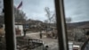 ARMENIA-AZERBAIJAN-KARABAKH-CONFLICT -- An Armenian soldier stands guard next to a road outside a house in the village of Shurnukh on March 4, 2021.