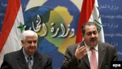 Syria's Foreign Minister Walid al-Muallim (left) and Iraq's Foreign Affairs Minister Hoshyar Zebari