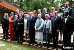 G7 leaders (including US President Donald Trump, center) pose for a photo at the June 16 summit in Evian, France.