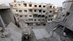 Разрушенный во время войны квартал в Думе, пригороде Дамаска 