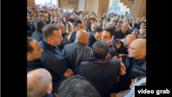Armenia - A young man argues with Prime Minister Nikol Pashinian's bodyguards at St. Anne's Church in Yerevan, March 29, 2026.