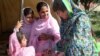 Pakistani member of parliament Bushra Gohar (right) visiting a camp of Internally Displaced persons in Khyber Pakhtunkhwa Province.