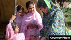 Pakistani member of parliament Bushra Gohar (right) visiting a camp of Internally Displaced persons in Khyber Pakhtunkhwa Province.