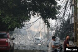 Urmările atacurilor israeliene asupra suburbiilor sudice din Bierut, 28 septembrie.