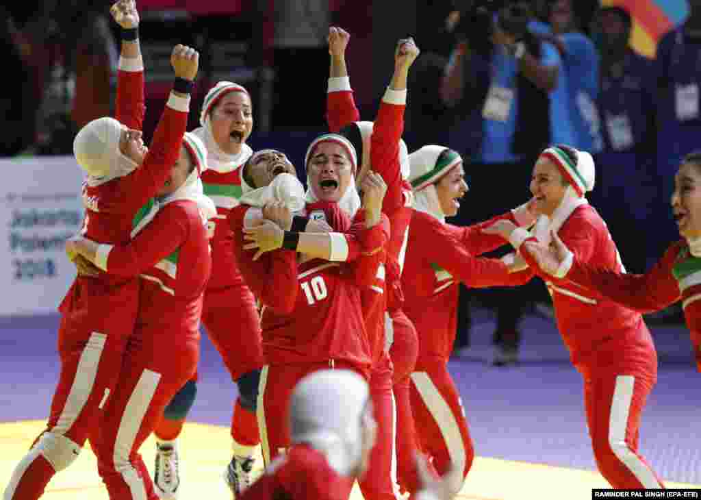 Iran&#39;s players celebrate after winning the women&#39;s kabaddi final against India at the 18th Asian Games in Jakarta, Indonesia, on August 24. Kabaddi is a sport that combine aspects of tag and tackle with wrestling moves. It has long been dominated by India. (EPA-EFE/Raminder Pal Singh)