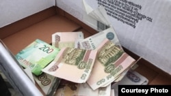 Сбор денег в Крыму для оплаты штрафа, наложенного властями на крымского активиста. Иллюстрационное фото