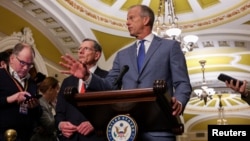 US Senate Majority Leader John Thune  flanked by Senate Republican Whip John Barrasso speaks to reporters on Capitol Hill in Washington. (file photo)