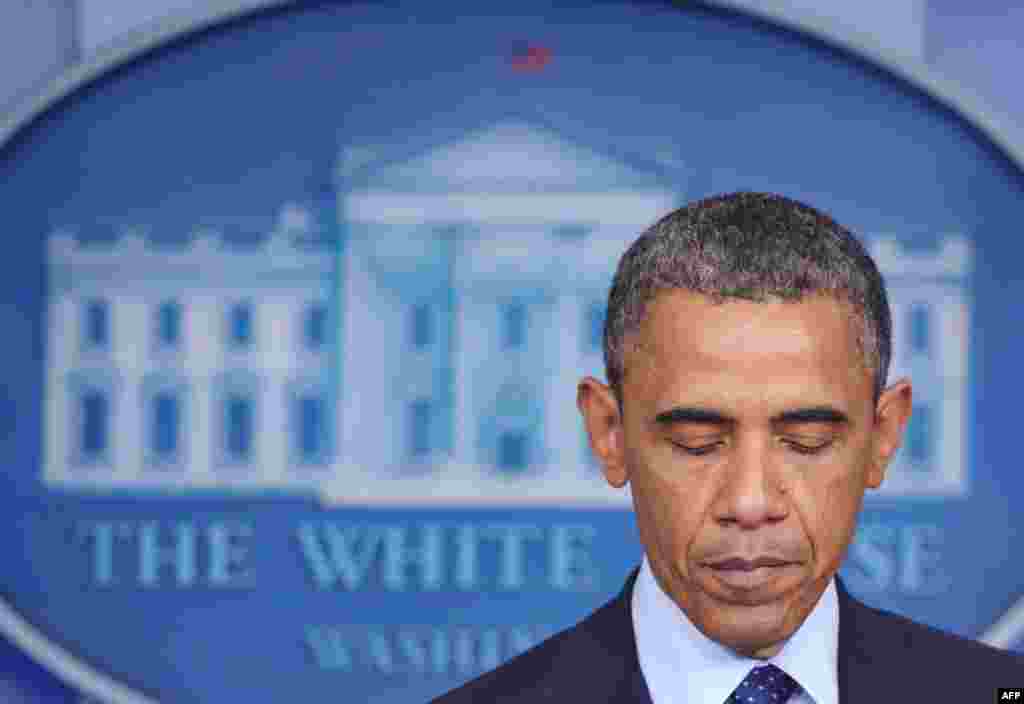 U.S. President Barack Obama pauses as he makes a statement on the Boston Marathon blasts.