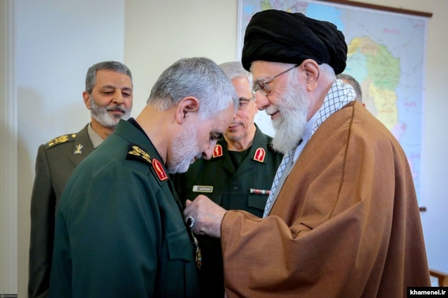 Qasem Soleimani (left) receives Iran's highest military award from Supreme Leader Ayatollah Ali Khamenei last summer.