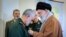 The commander of the Revolutionary Guards' elite Qods Force, Qassem Soleimani (left), received Iran's highest military award, the country's supreme leader announced on March 11, 2019.