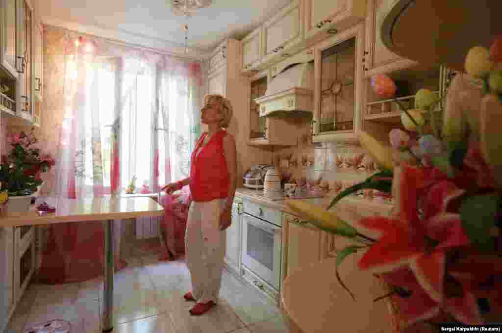 Anti-demolition activist Kari Guggenberger inside her newly renovated apartment, which has been scheduled for demolition. The 35-year-old began a highly active Facebook page opposing the latest demolition plans that now has more than 23,000 followers.