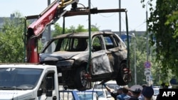 Обломки автомобиля после взрыва СВУ, в результате которого 9 июня 2026 года в Балашихе, под Москвой, погиб водитель. (Фото Игоря Иванко / AFP)
