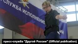 Olga Shalina cut her veins at the the Interpolitekh exhibition of police and military equipment in Moscow on October 25. 
