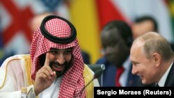 ARGENTINA -- Saudi Arabian Crown Prince Mohammed bin Salman speaks with Russia's President Vladimir Putin during the opening of the G20 leaders summit in Buenos Aires, November 30, 2018