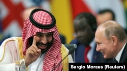 ARGENTINA -- Saudi Arabian Crown Prince Mohammed bin Salman speaks with Russia's President Vladimir Putin during the opening of the G20 leaders summit in Buenos Aires, November 30, 2018