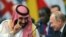 ARGENTINA -- Saudi Arabian Crown Prince Mohammed bin Salman speaks with Russia's President Vladimir Putin during the opening of the G20 leaders summit in Buenos Aires, November 30, 2018