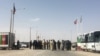 FILE: A prisoner exchange along the border between Iran and Afghanistan.