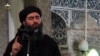 An image grab taken from a propaganda video released on July 5, 2014 by al-Furqan Media allegedly showing the leader of the Islamic State (IS) jihadist group, Abu Bakr al-Baghdadi, at a mosque in Mosul.