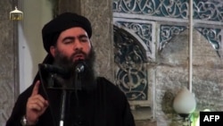 A screengrab taken from a propaganda video released in 2014 showing the leader of the Islamic State extremist group Abu Bakr al-Baghdadi