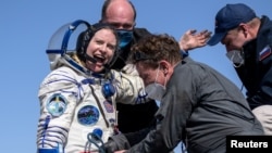 ISS crew member Kathleen Rubins of NASA reacts shortly after the landing of the Soyuz MS-17 space capsule in a remote area outside Zhezkazgan, Kazakhstan, on April 17.