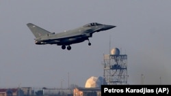 A Typhoon aircraft prepares to land at the British Royal Air Force base in Akrotiri, near the coastal city of Limassol on the eastern Mediterranean island of Cyprus early on April 14.