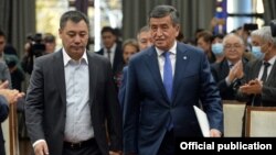 The new prime minister of Kyrgyzstan, Sadyr Japarov (left), and the former president, Sooronbai Jeenbekov, in Bishkek on October 16