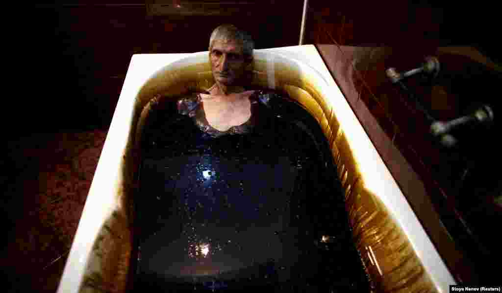 A man lies in a bathtub filled with crude oil during a health therapy session at Naftalan Health Center in Baku. The abundance of oil in Azerbaijan has kept its economic wheels turning since independence, but with little diversity in the economy the country is now facing an unprecedented crisis.