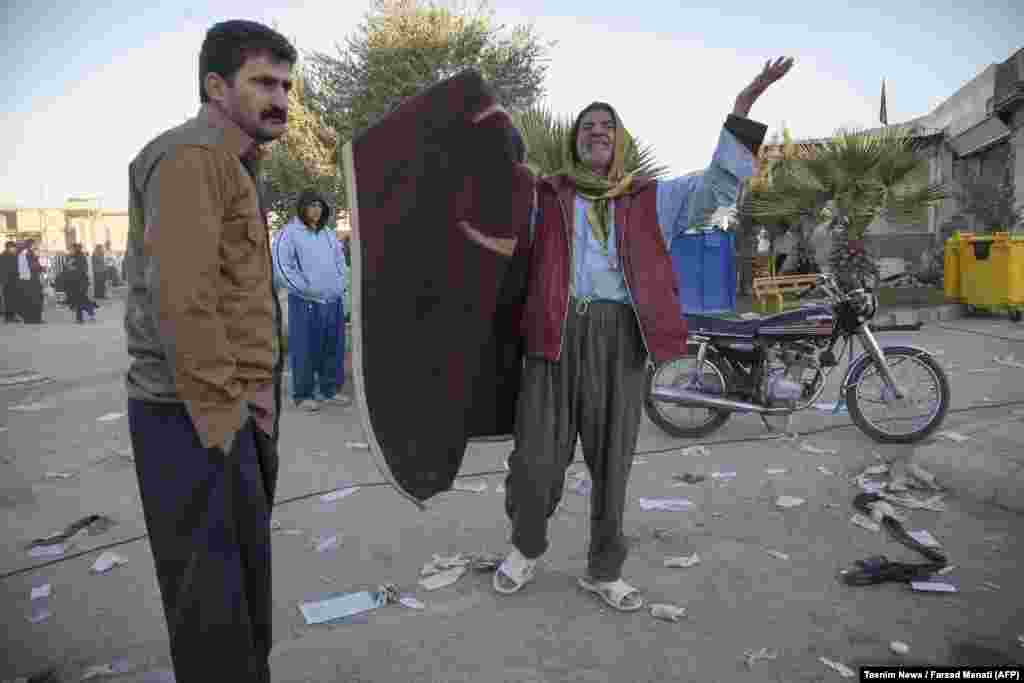 A man reacts to the destruction in Sarpol-e Zahab.