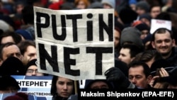 People attend a protest against the bill about sovereign RuNet and censorship on the Internet, in Moscow in March 2019.