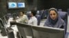 Iran -- Iranian TV anchor Suzanne Modaressi (R) works at the newsroom of Iranian news channel "Press TV" in Tehran, 20Jun2007