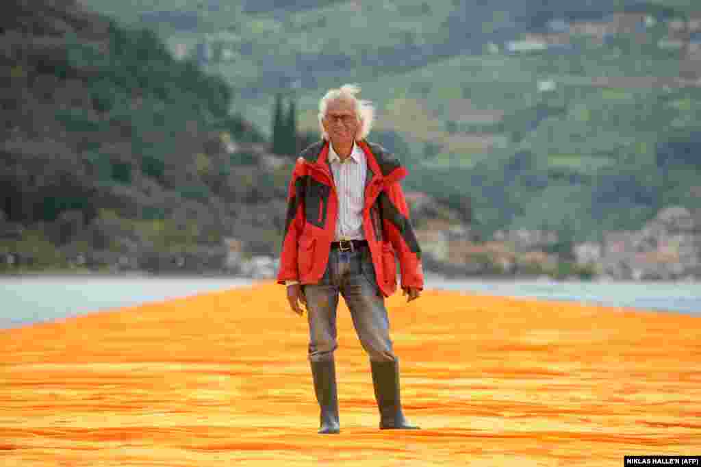 Christo poses on The Floating Piers on Lake Iseo in June 2016.