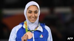 Iran's Kimia Alizadeh poses with herbronze medal at the Rio Olympics in 2016.