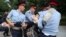 KAZAKHSTAN -- Police officers detain a woman during an opposition rally. June 12, 2019. 