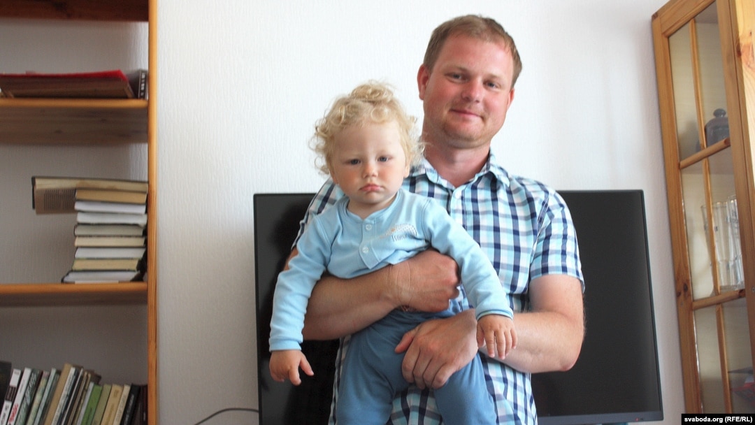 Andrey Sharenda, pictured with son Stakh in 2017, says he is trying to create some sense of normalcy for his children during their exile in Vilnius since his wife, Palina Sharenda-Panasyuk, was imprisoned in their native Belarus.