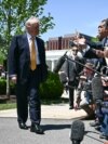US President Donald Trump (center) arrives at Beijing airport on May 13.