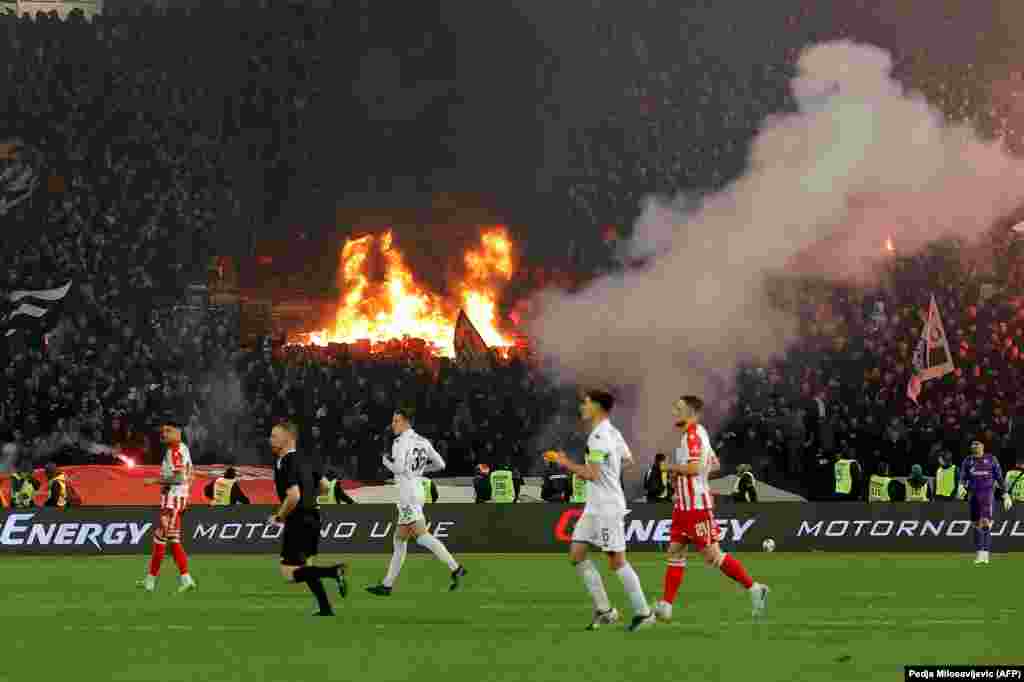 Arena seats burn in a section of the Partizan crowd at Red Star's Rajko Mitic Stadium on February 22. The match was suspended for several minutes as firefighters dealt with the blaze.Geographically, the two sides are the closest of close rivals, with the teams’ home stadiums located just half a kilometer apart in south Belgrade.