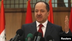 Kurdish President Masud Barzani speaks during a news conference in Baghdad today.