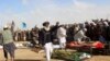 Relatives participate in the funeral of Afghan civilians reportedly killed in a NATO operation in November, 2015.